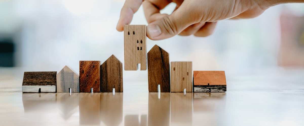 wooden houses to represent landlord insurance