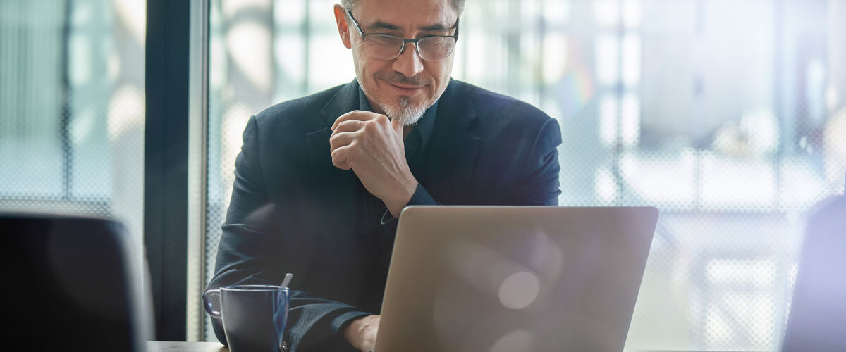 businessman working on laptop in the commercial insurance industry